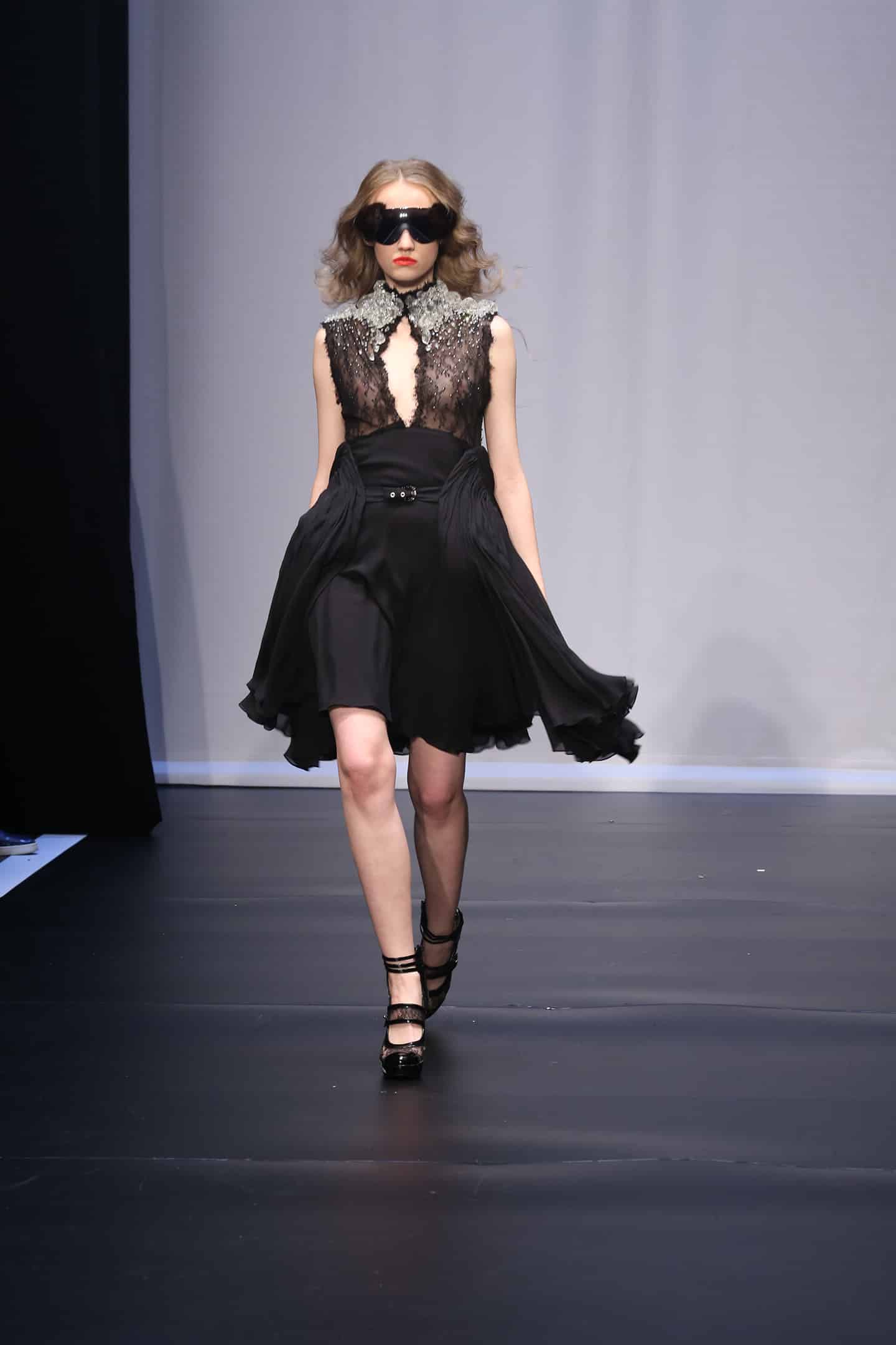 model couture in black shifon lace walking in on aura tout vu fashion show in saint petersburg