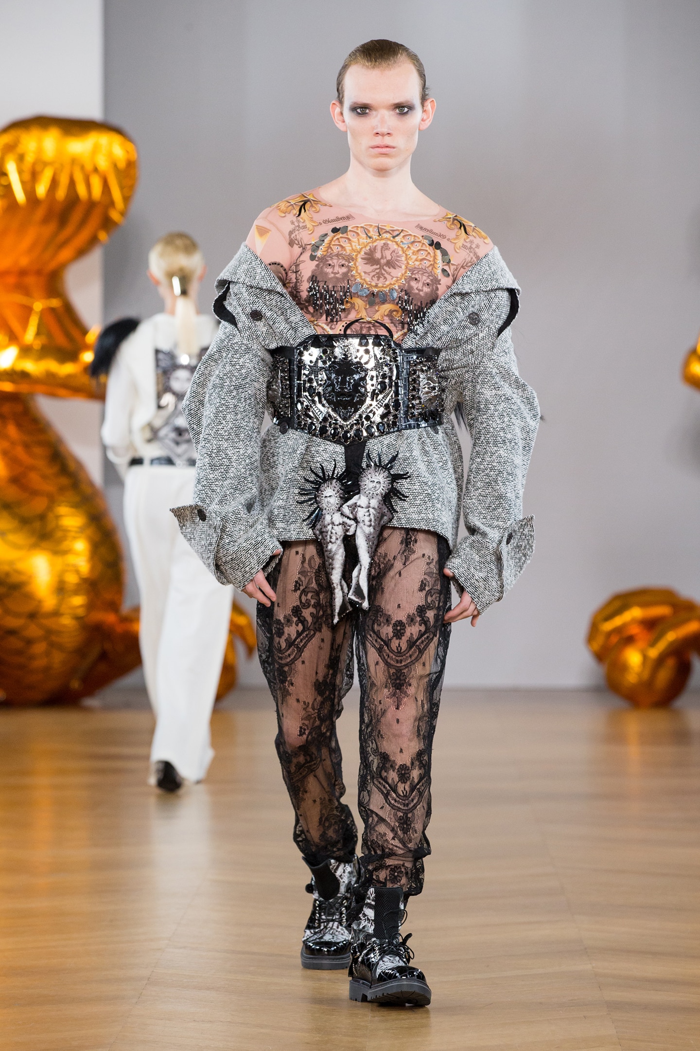 Boy male model wearing couture coat and lace pants crystal belt on aura tout vu 