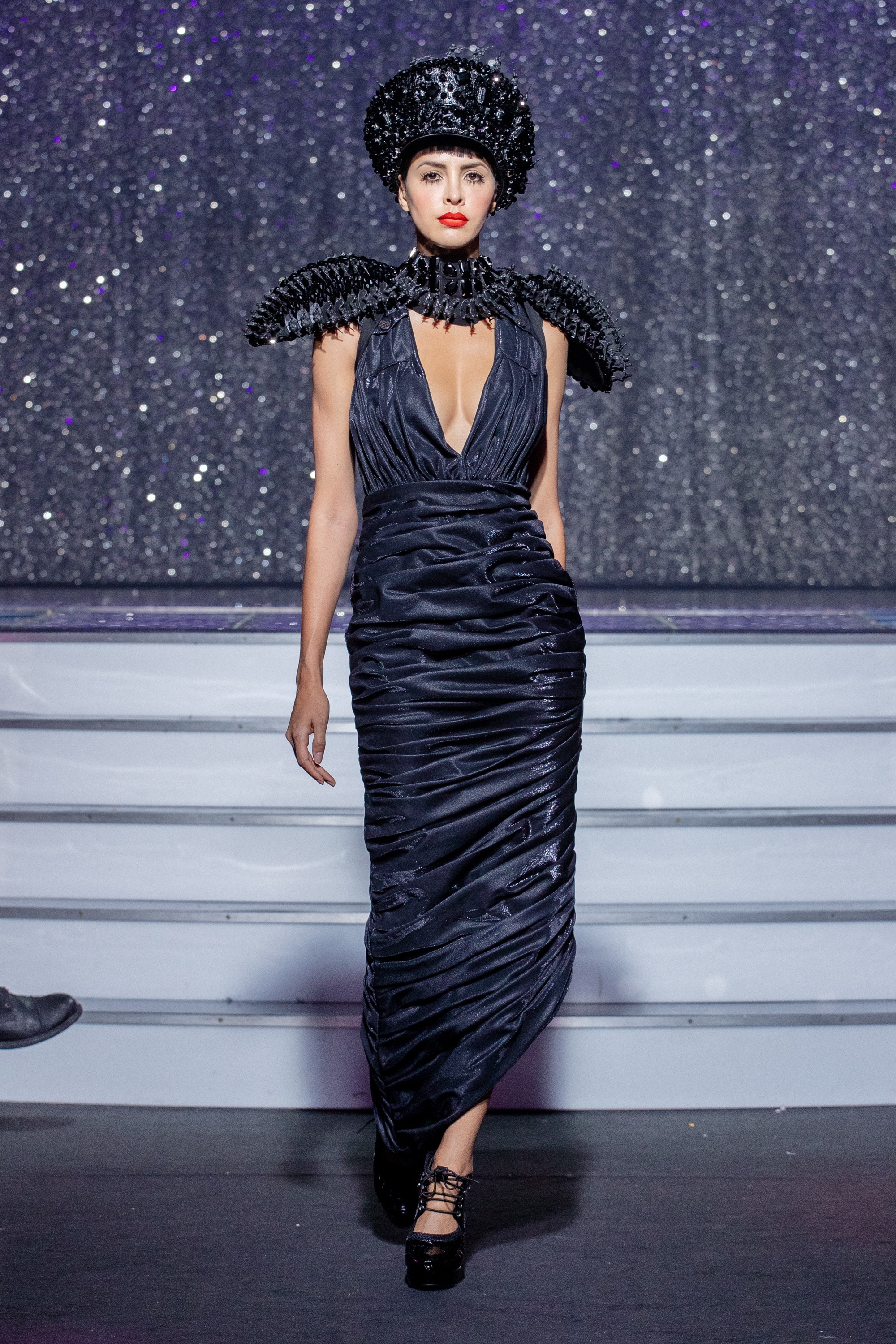 a model wearing black outfit  crystal   sholders and hat  by on aura tout vu haute couture spring summer 2020