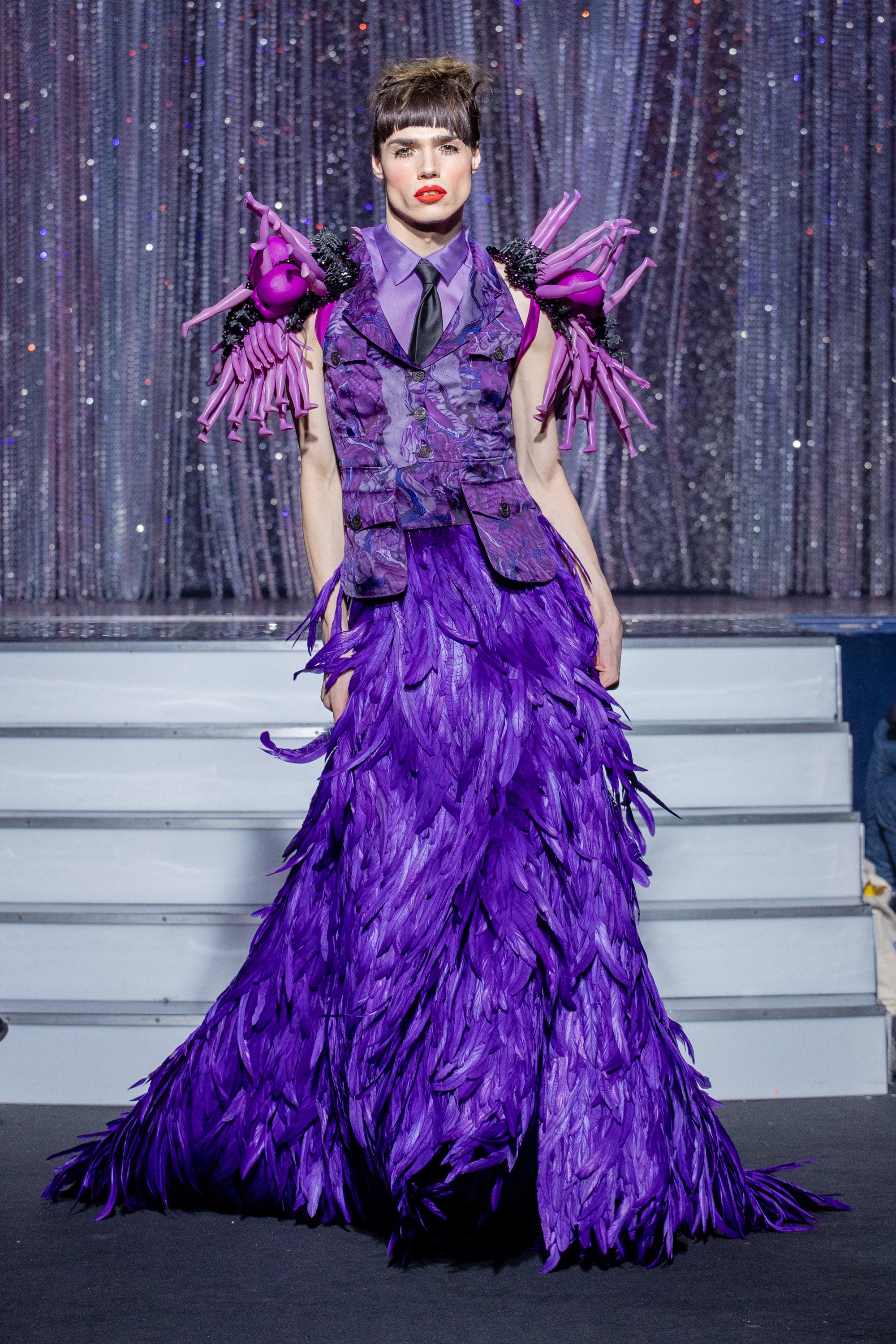 a men model wearing  purpple silk  and feathers outfit  crystal  by on aura tout vu haute couture spring summer 2020