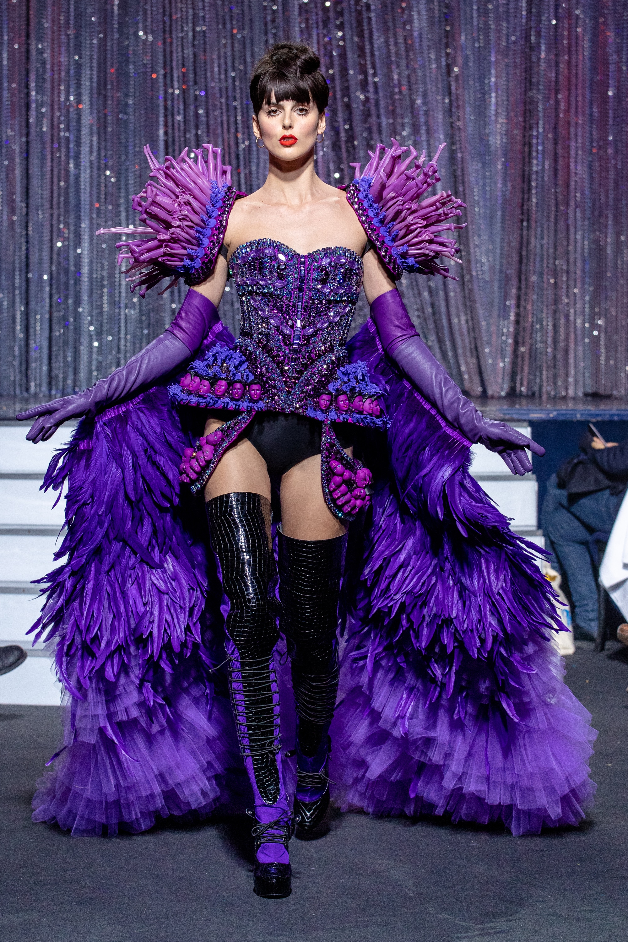 a model wearing  purpple crystal corset  outfit  crystal  and feathers  by on aura tout vu haute couture spring summer 2020