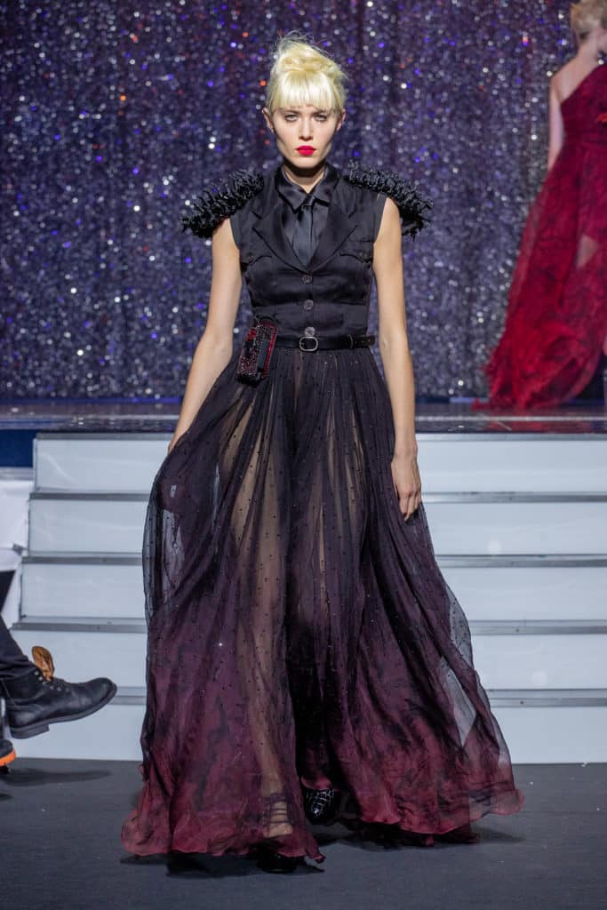 a model wearing  dark red silk  outfit  crystal  and belt  by on aura tout vu haute couture spring summer 2020